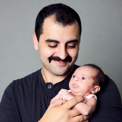 Father holding newborn baby