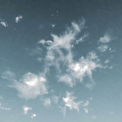 Fluffy white clouds in blue sky