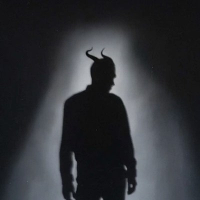 Silhouette of man with demon horns