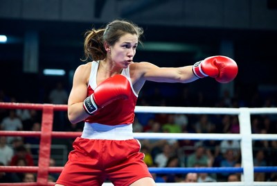 Woman boxing in red gloves
