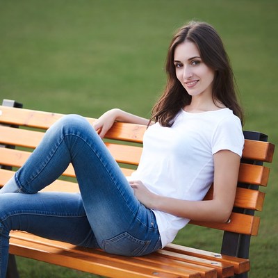 Woman sitting on park bench