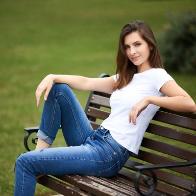 Woman sitting on park bench