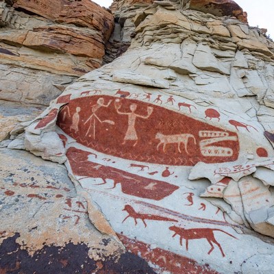 Ancient rock art with humans and animals