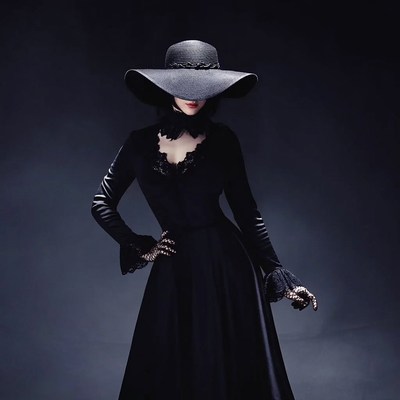 Woman in Black Lace Dress and Wide Hat