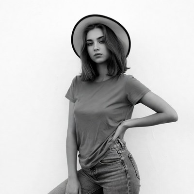 Young woman in wide-brim hat