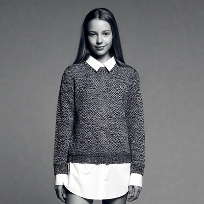 Teen girl in sweater and collared shirt