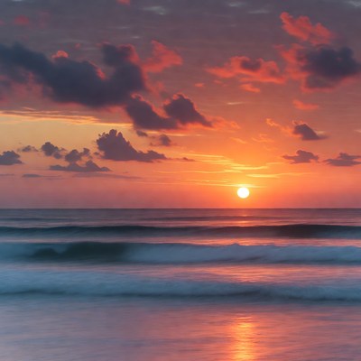 Sunset over ocean waves