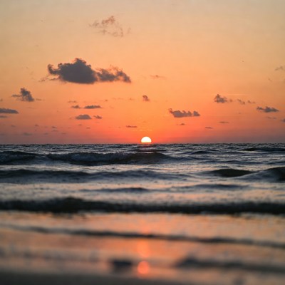 Sunset over ocean waves