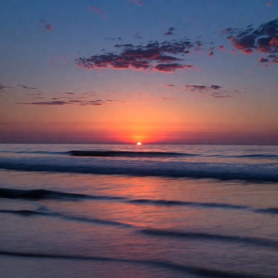 Sunset over ocean waves