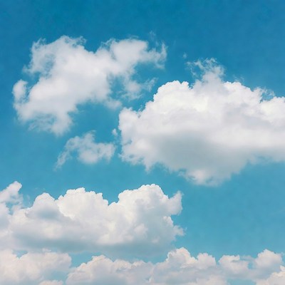 Fluffy White Clouds in Blue Sky