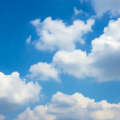 Fluffy White Clouds in Blue Sky