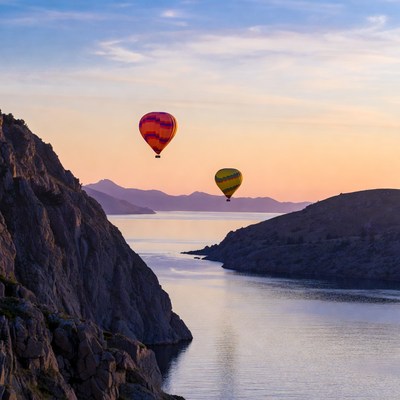 Hot Air Balloons Over Coastal Cliffs