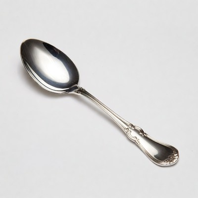 Silver ornate teaspoon isolated