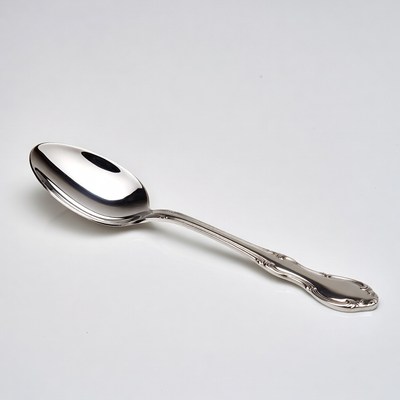 Shiny silver spoon on white background