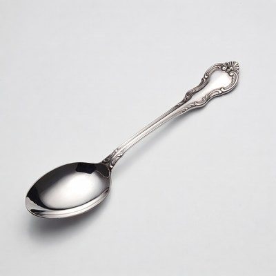Silver ornate teaspoon isolated