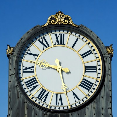Ornate Gold Clock on Blue Sky