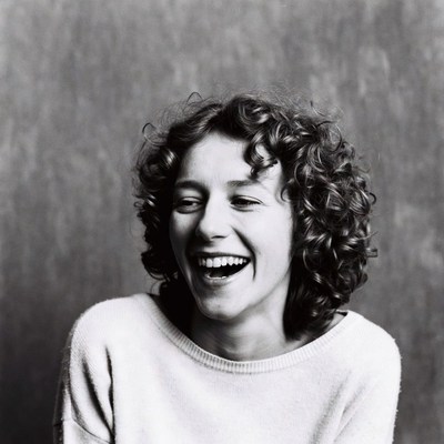 Smiling woman with curly hair