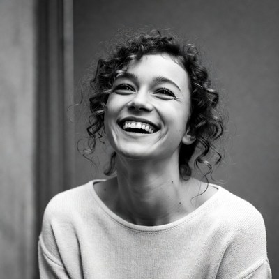 Smiling woman with curly hair