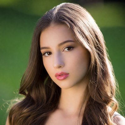 Beautiful woman with brown hair outdoors