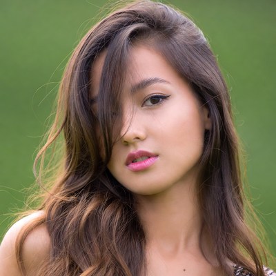 Asian woman with long hair outdoors