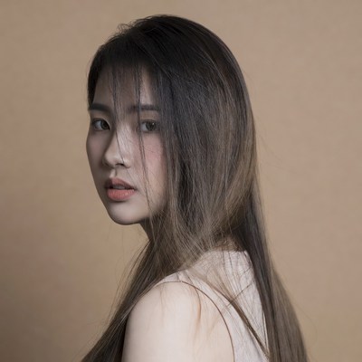Asian woman with long hair profile view