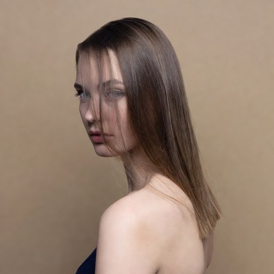 Woman with long brown hair profile view