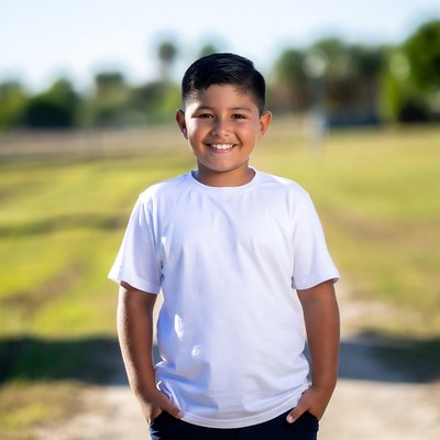 Smiling Latino boy in white t-shirt
