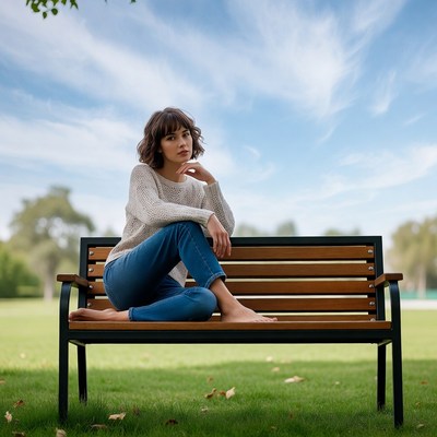 Woman sitting on park bench