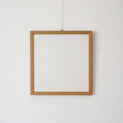 Empty Wooden Frame on White Wall