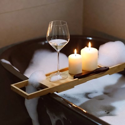 Wine Glass and Candles on Bathtub Tray