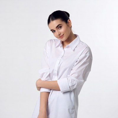 Smiling woman in white shirt