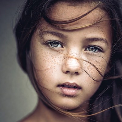 Girl with freckles and flowing hair