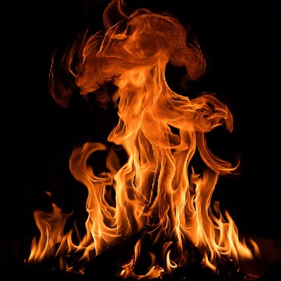 Fiery Flames Burst on Black Background