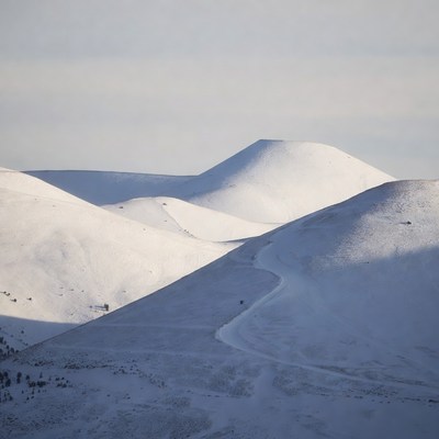 Snowy Hills with Winding Trail