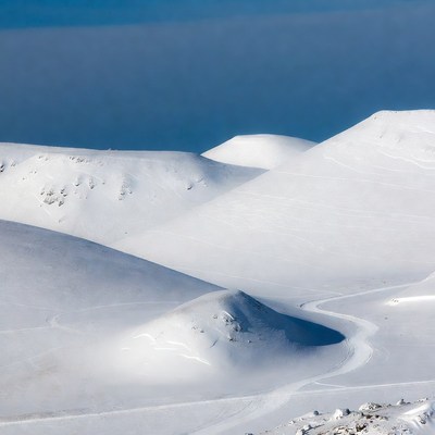 Snowy Mountains with Ski Tracks