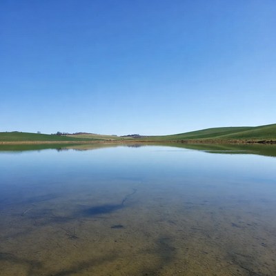 Green Hills Reflecting in Calm Pond