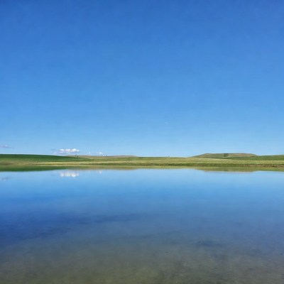 Reflective Pond in Green Hills
