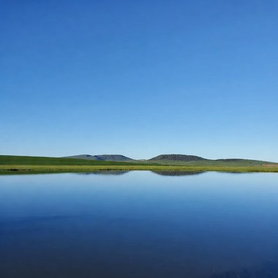 Green Hills Reflected in Calm Lake