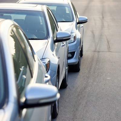 Row of Parked Silver Cars