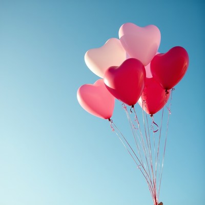 Pink and Red Heart Balloons in Blue Sky
