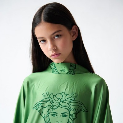 Teen girl in Versace Medusa green shirt