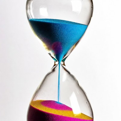 Colorful Hourglass with Sand Flowing