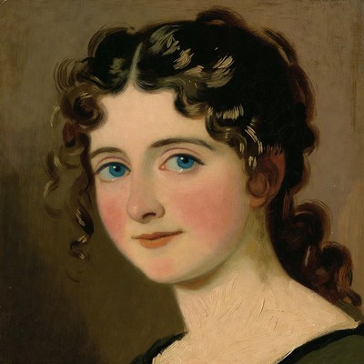 Portrait of young woman with curly black hair