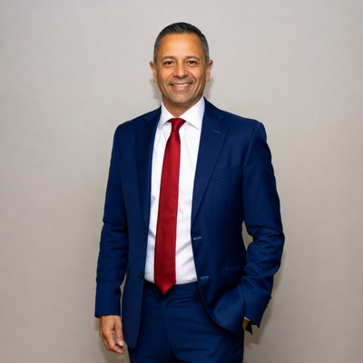 Man in blue suit with red tie