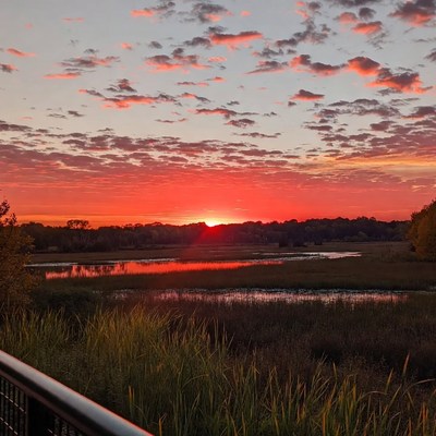 Sunset over marsh with reflection