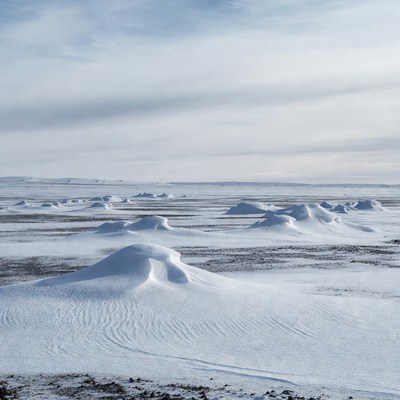 Snowy Hills in Vast Arctic Landscape