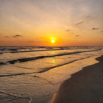 Sunset over ocean waves