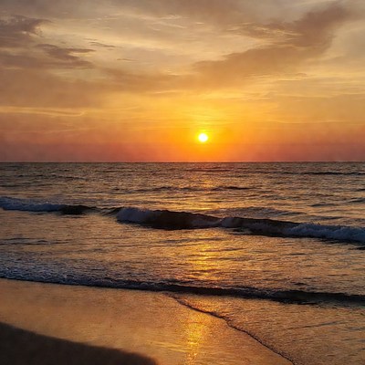 Sunset over ocean waves