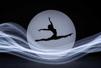 Silhouette woman splits in front of moon