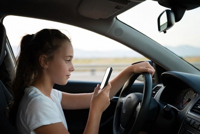 Girl texting while driving car